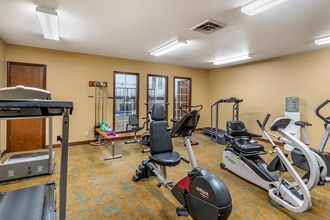 A small fitness center with various exercise machines and equipment.