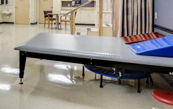 An examination table in a healthcare facility.