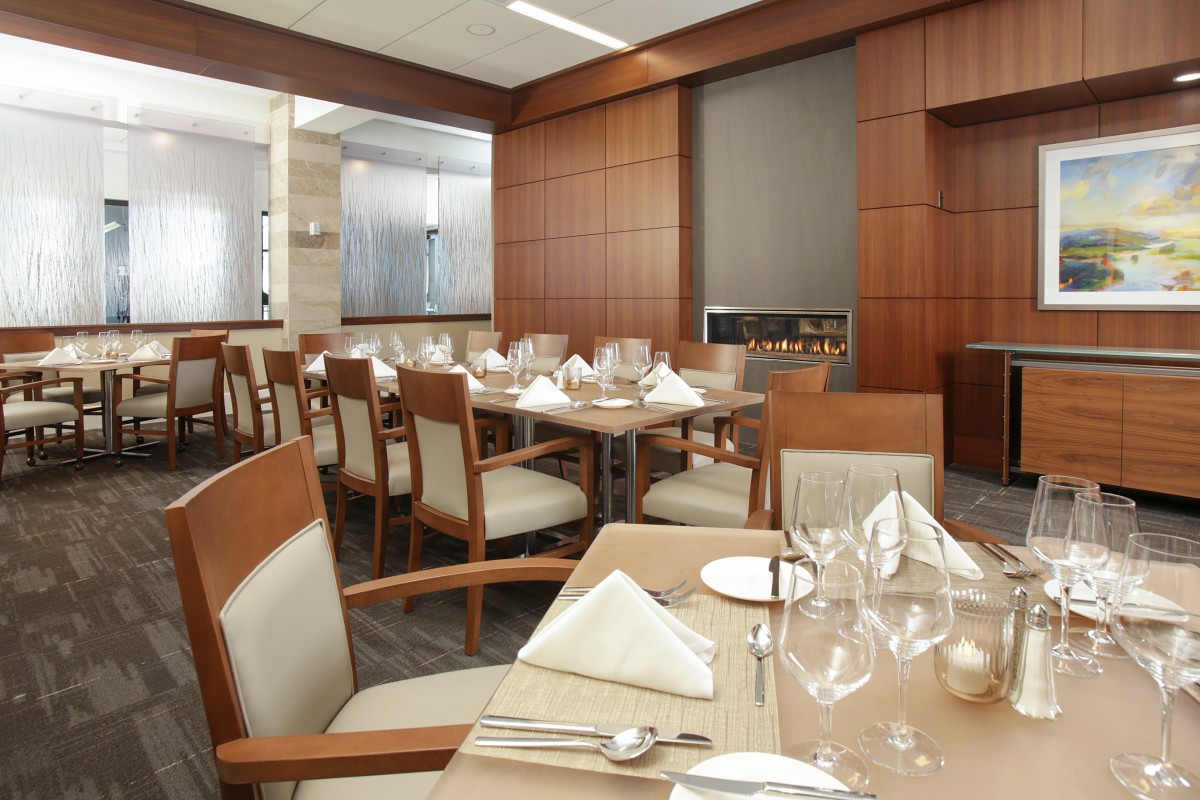 A well-arranged dining area with neatly set tables and chairs, ready for patrons.