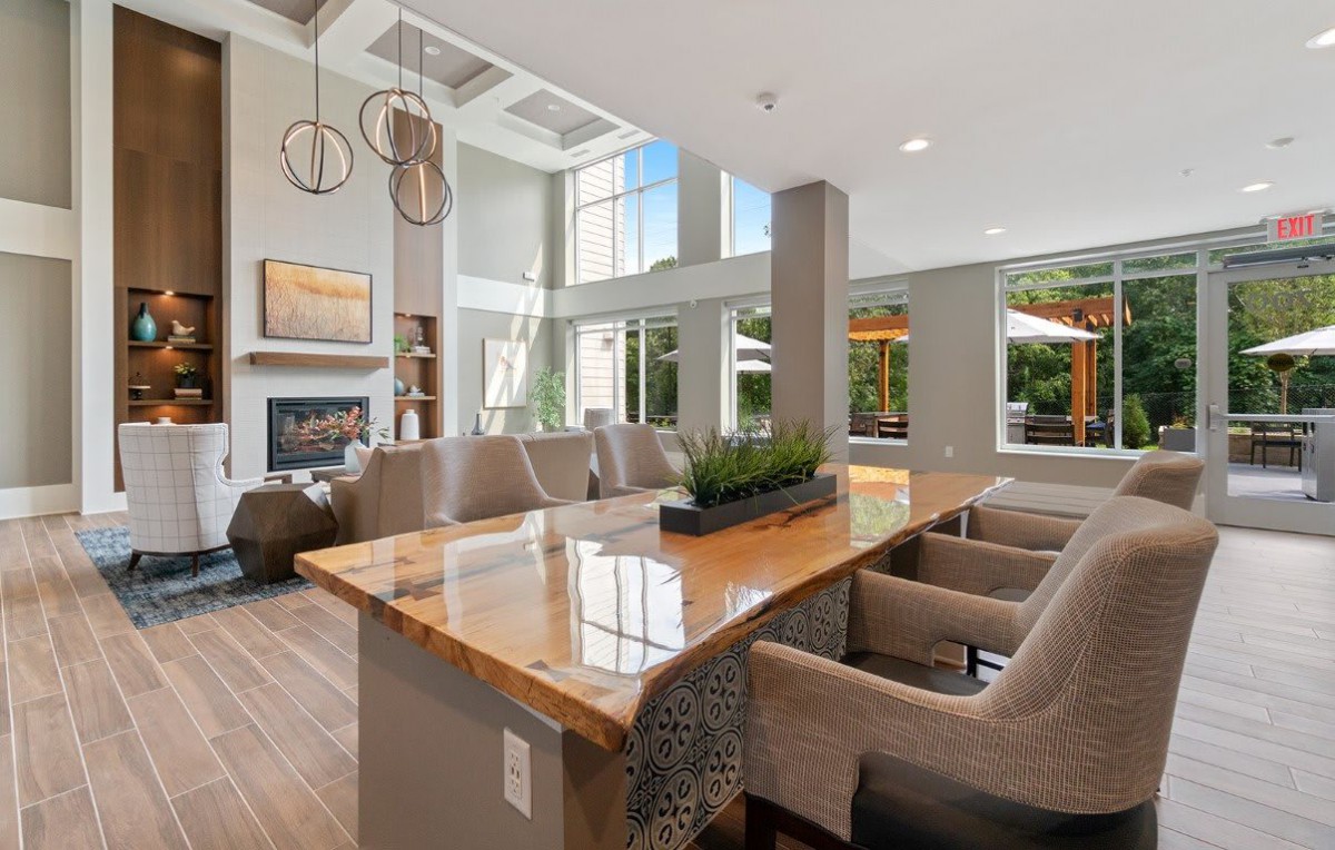 A spacious and modern living area with elegant furnishings and ample natural light.