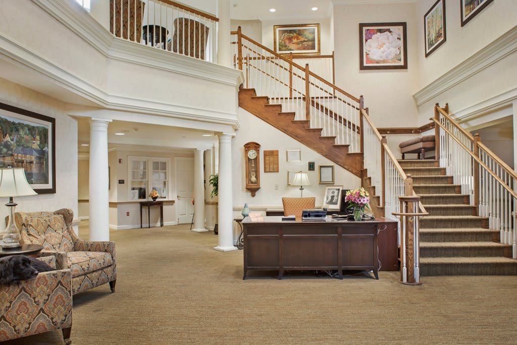 Spacious and elegant office reception area with a staircase.