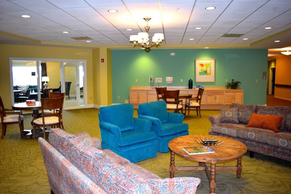 A cozy living room with colorful furniture and elegant decor.