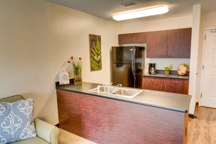 A modern kitchen with sleek cabinetry, stainless steel appliances, and a clean countertop design.