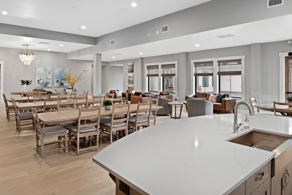 A modern open-layout living and dining area with ample seating.
