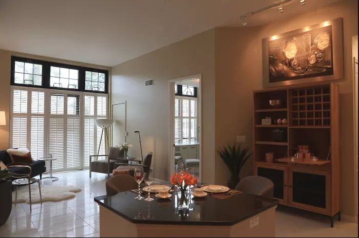 A modern open-concept living room and dining area with elegant furniture and decor.