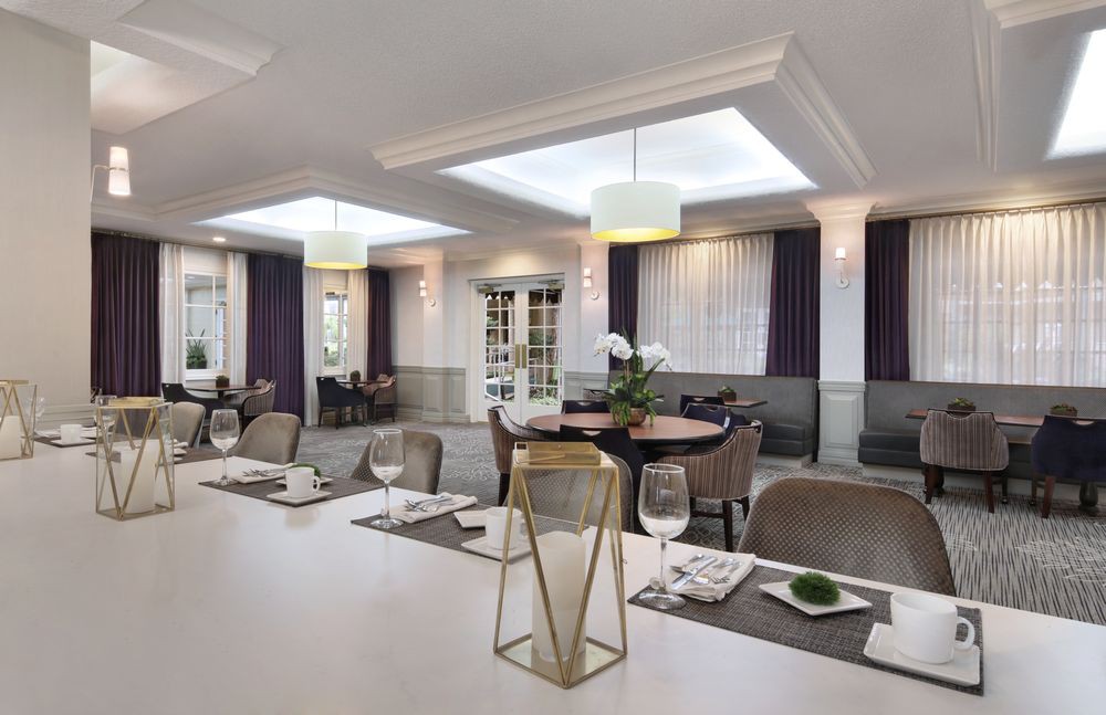 A modern and elegant restaurant interior with well-arranged table settings and stylish decor.