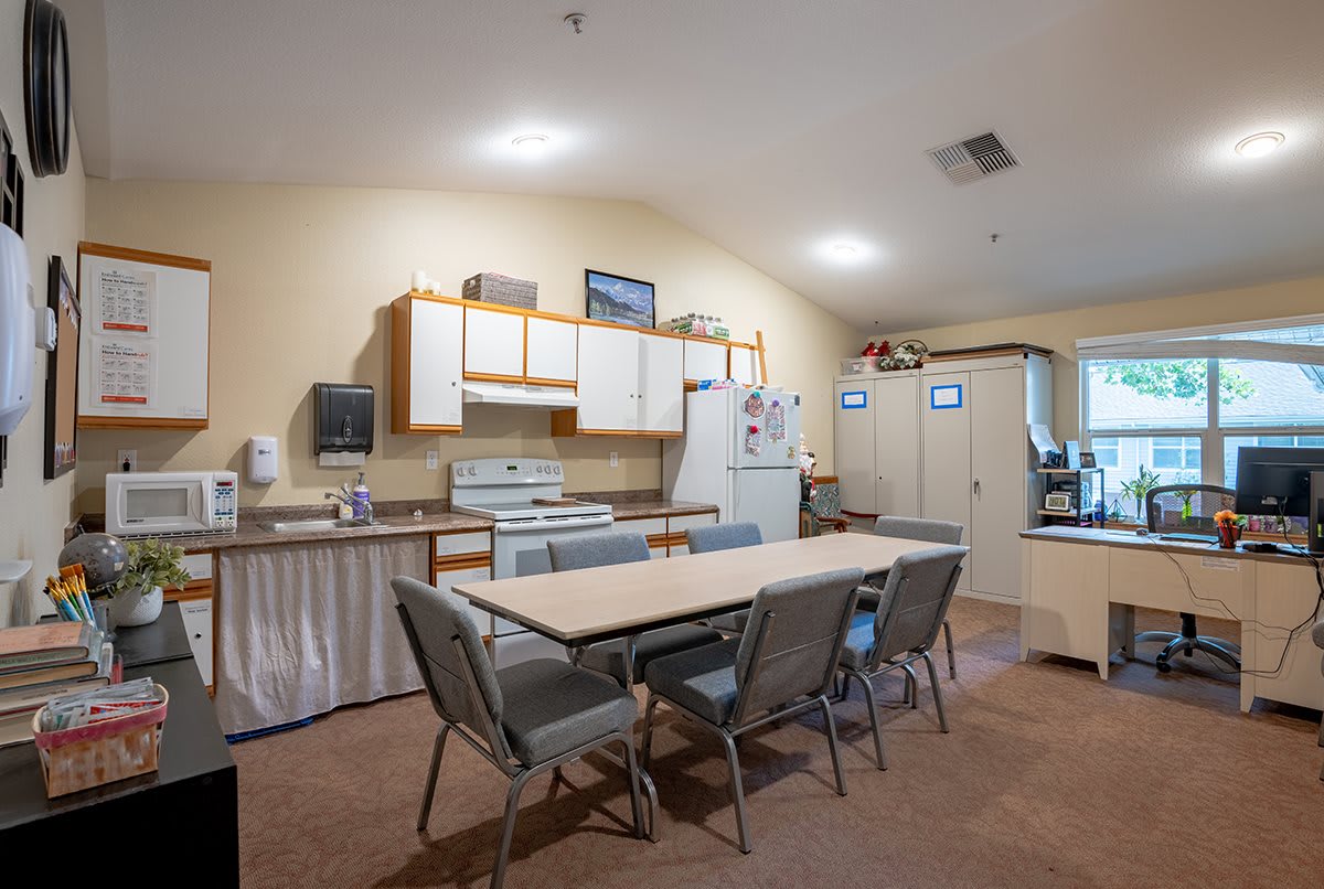 A spacious kitchen and dining area with modern amenities.