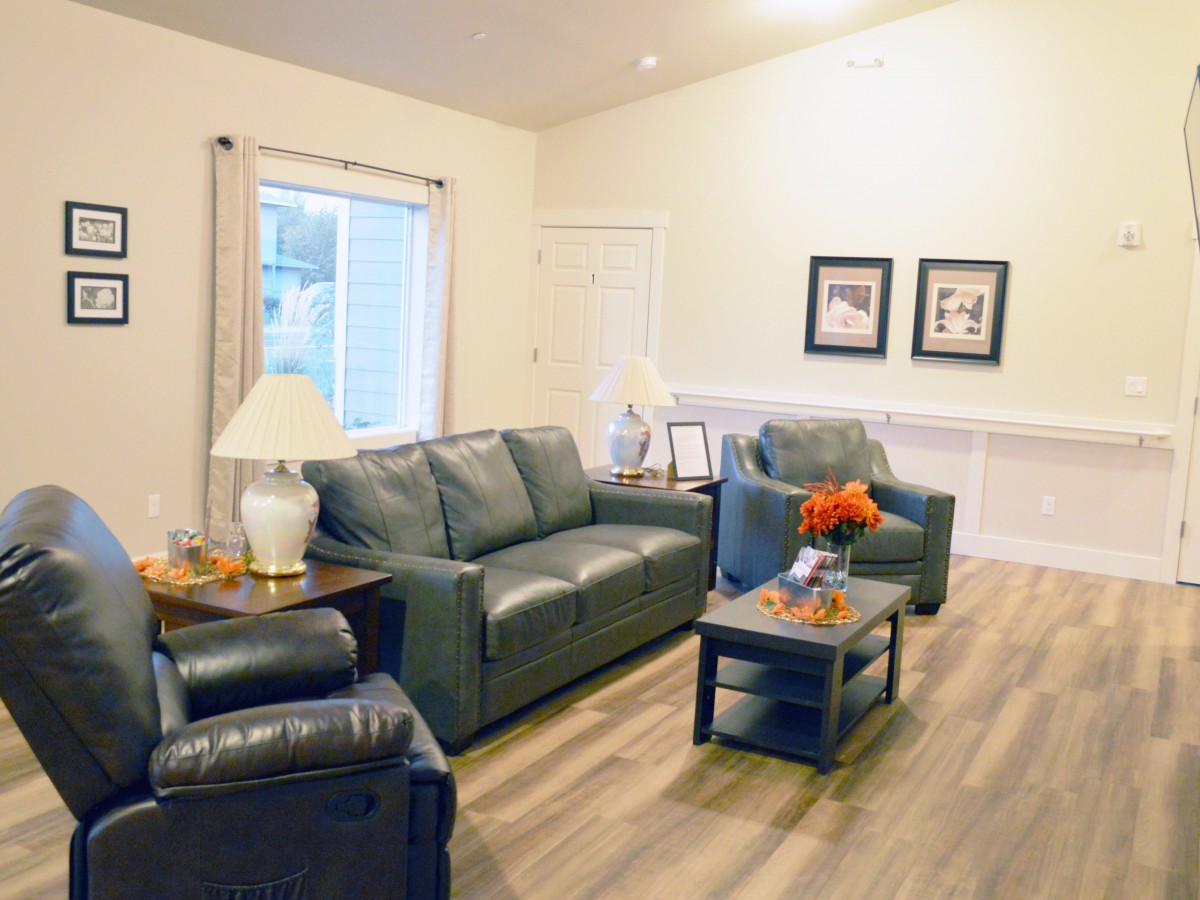 A cozy living room with modern furniture and soft lighting.