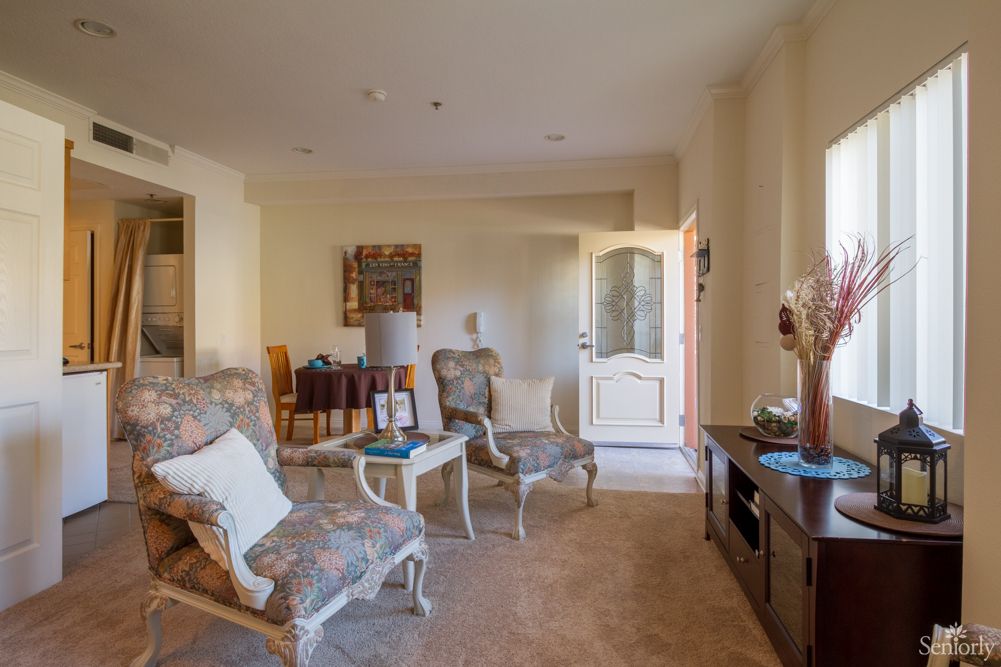 A classic-styled living room with elegant armchairs and a warm, inviting ambiance.