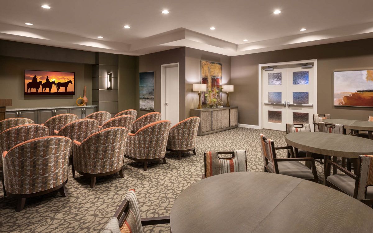 A cozy lounge area with comfortable seating and warm lighting.