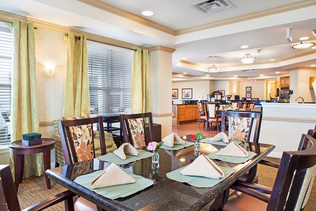 A well-set dining table in a cozy restaurant interior.