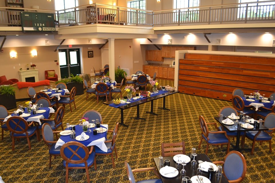 An elegant indoor dining area with tables and chairs arranged for guests.