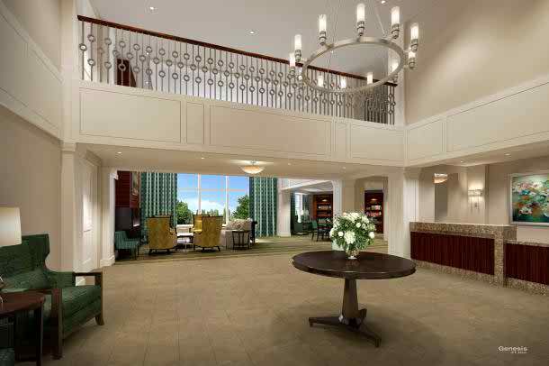 A spacious and elegantly designed lobby with a grand chandelier, comfortable seating area, and sophisticated decor.