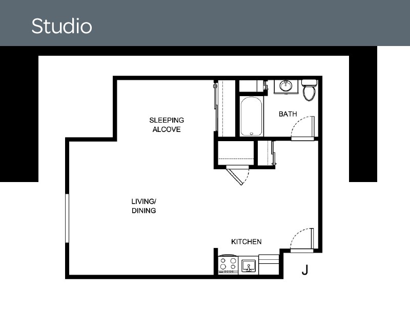 A floor plan of a studio apartment with a sleeping alcove, living/dining area, kitchen, and bathroom.