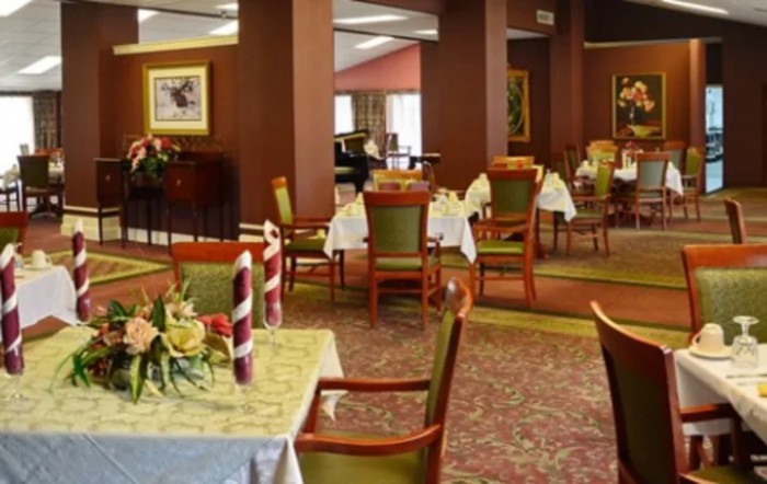 Elegant dining area with neatly arranged tables and chairs.