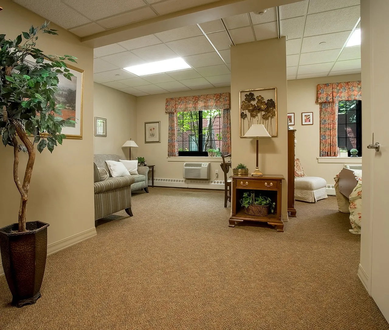 A cozy living room with comfortable seating and warm lighting.