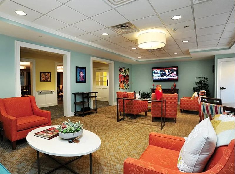 A modern living room with comfortable seating and a television.
