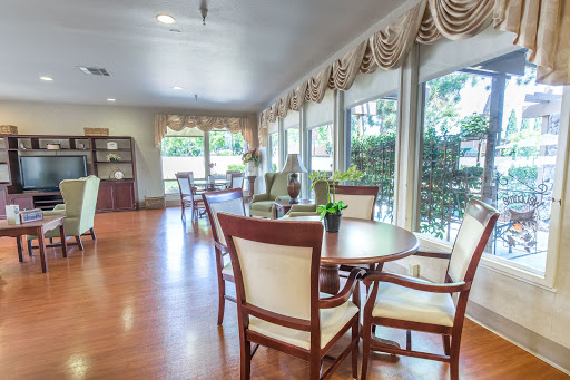 A bright and inviting lounge area featuring comfortable seating and ample natural light.