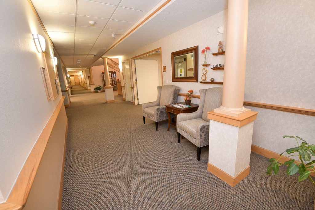 A cozy hallway with chairs and decorative elements.
