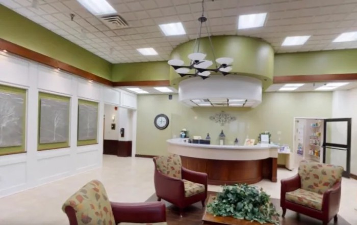 A modern reception area with comfortable seating and a sleek design.