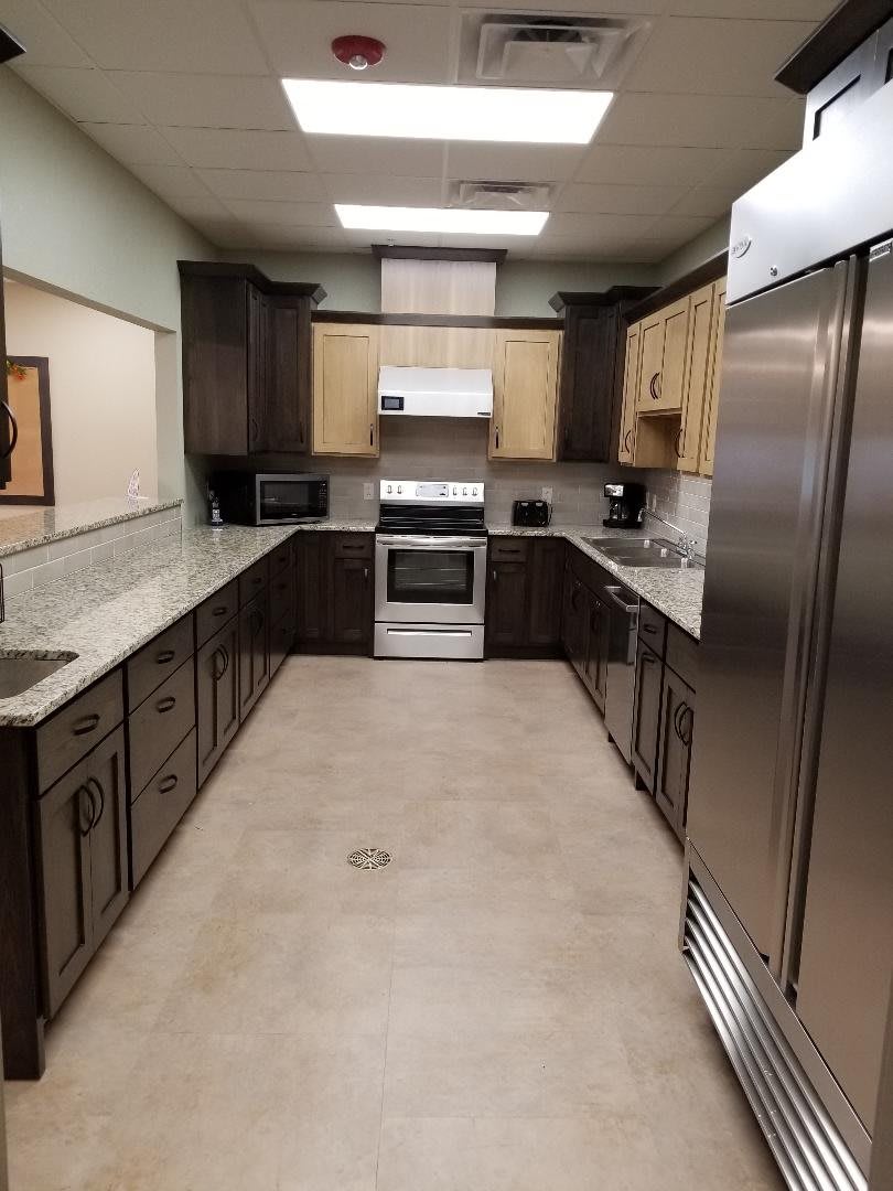 A modern kitchen with stainless steel appliances and spacious countertops.