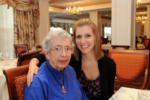 A joyful moment shared between a grandmother and her granddaughter, capturing the warmth of family ties.