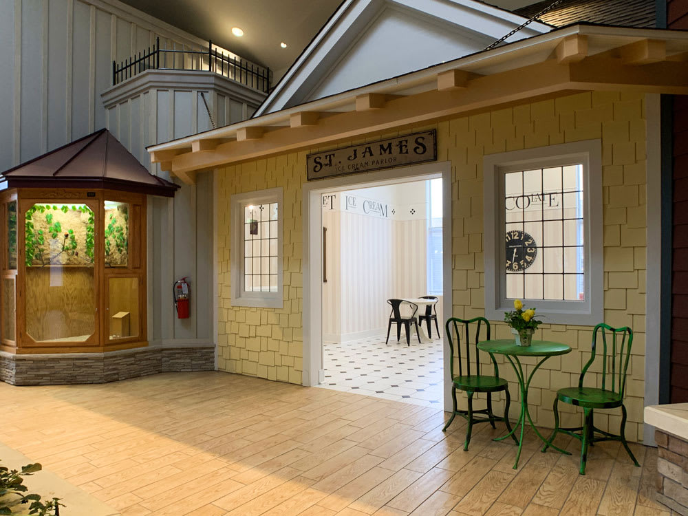 An indoor cafe setting with a charming seating area and decorative elements.