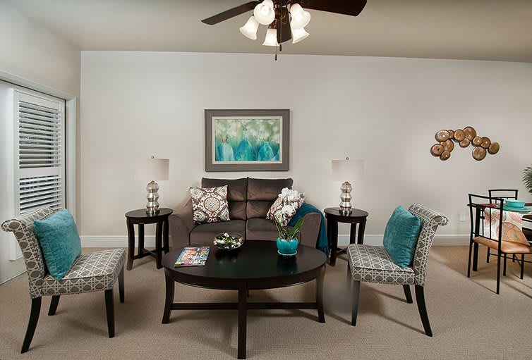 A modern living room with a stylish sofa, coffee table, and decorative accents.
