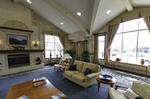 A cozy living room with comfortable sofas and large windows letting in natural light.
