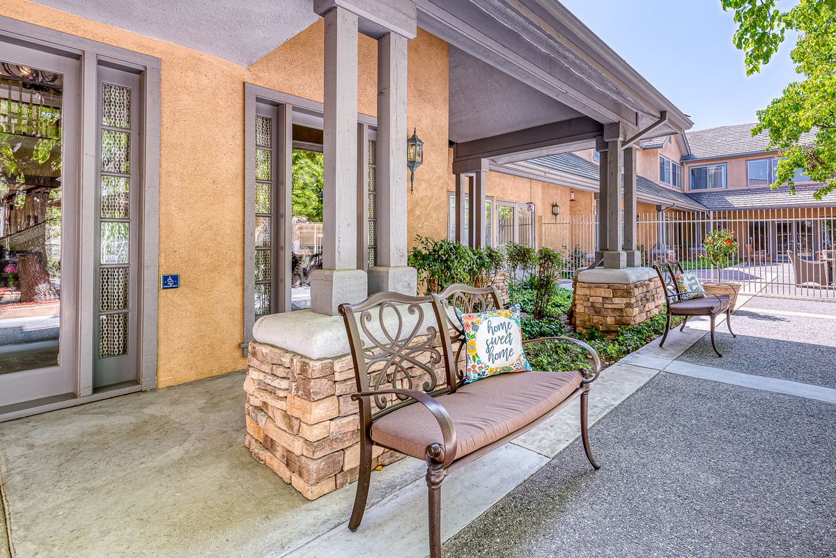 Outdoor seating area with benches and architectural details.