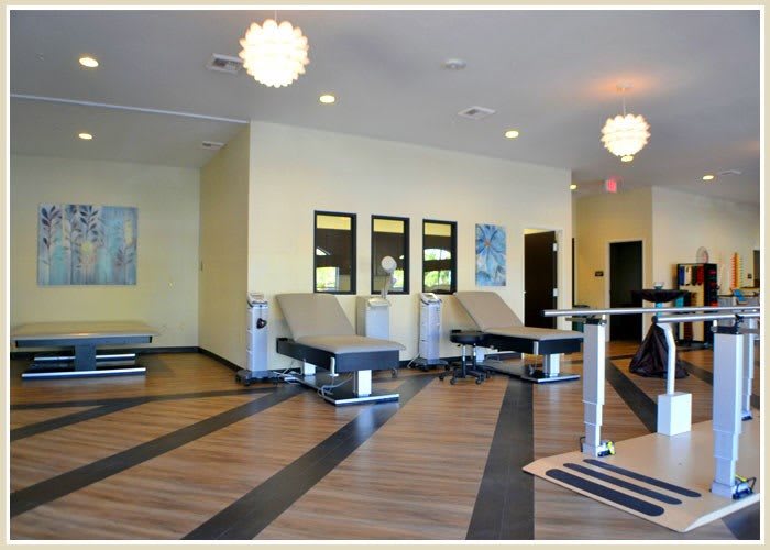 A modern fitness gym with sleek exercise equipment and contemporary interior design.