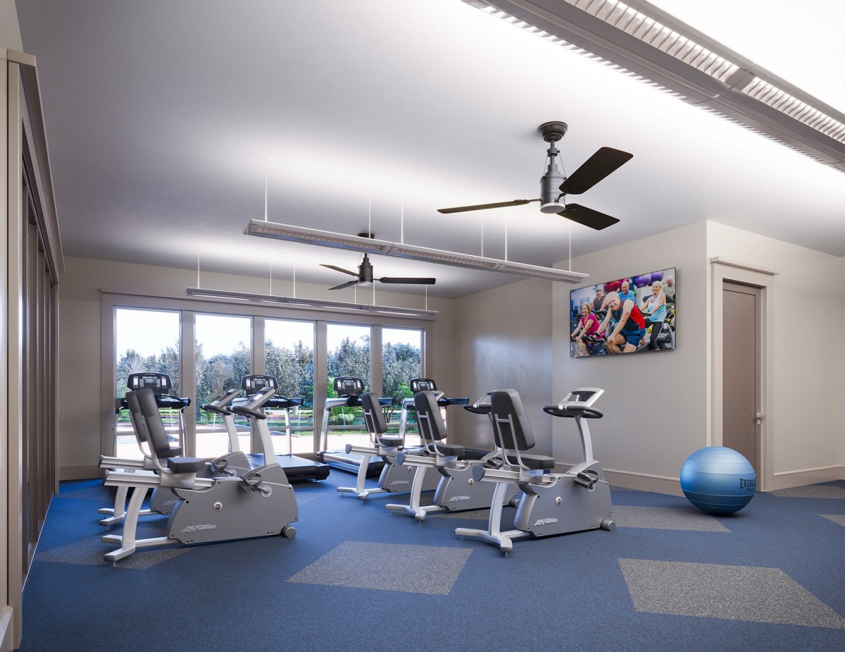 A modern gym interior featuring exercise bikes and fitness equipment.