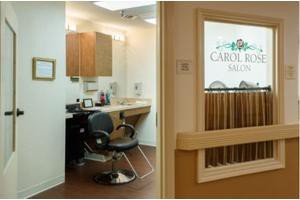 A cozy hair salon with a styling chair and mirror, featuring a sign on the door reading 'Carole's Salon.'