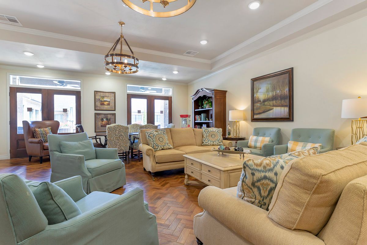 A cozy living room featuring comfortable seating and elegant decor.