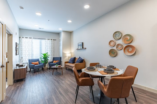 A bright and inviting living space featuring modern furniture and stylish decor.