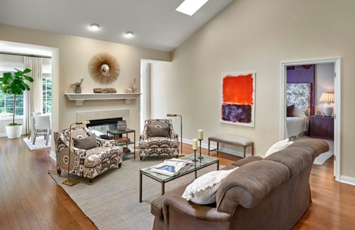 A modern living room featuring stylish furniture and vibrant artwork.