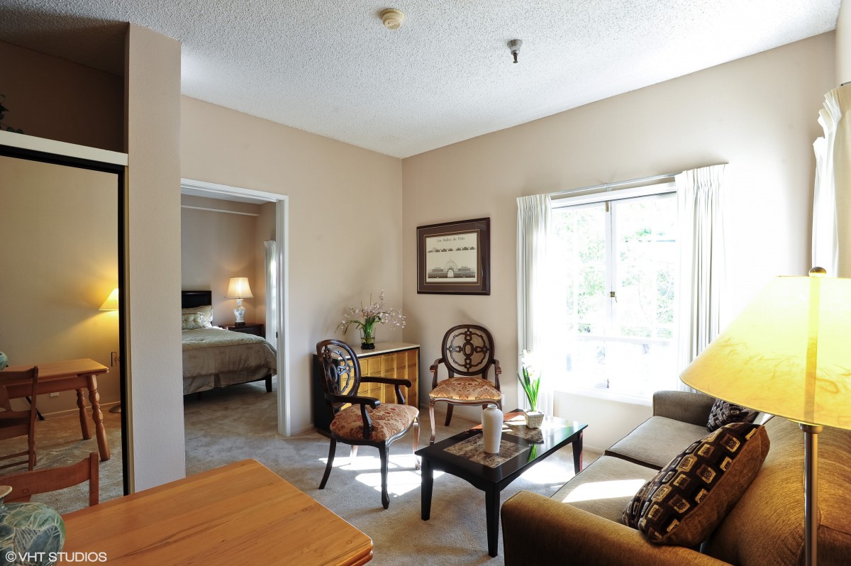 A cozy living room with elegant furniture and ample natural light.