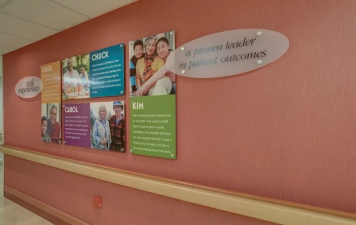 A hospital wall display featuring family and children-themed informational panels.