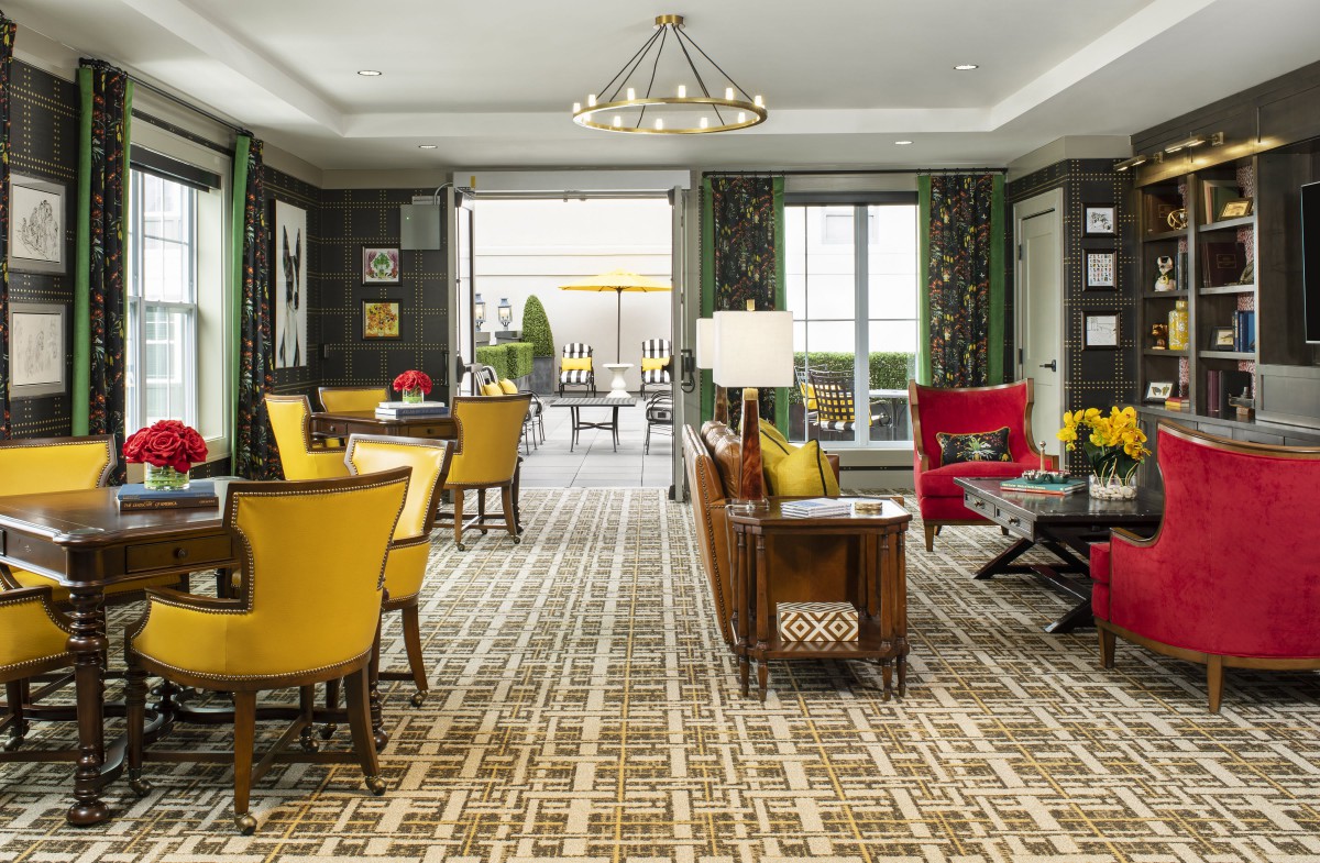 A luxurious living room interior with modern furniture and decorative elements.