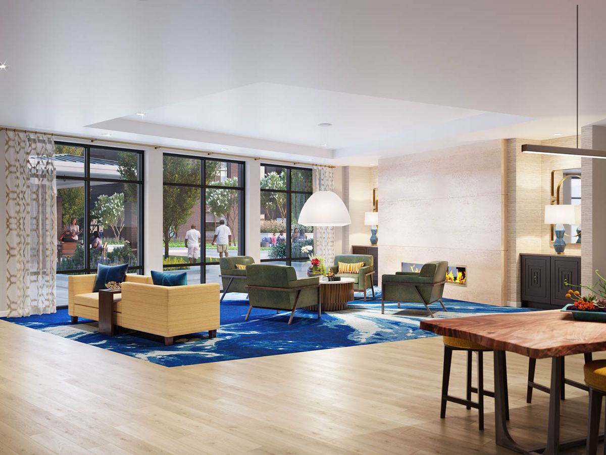 A modern lobby with comfortable seating and large windows.