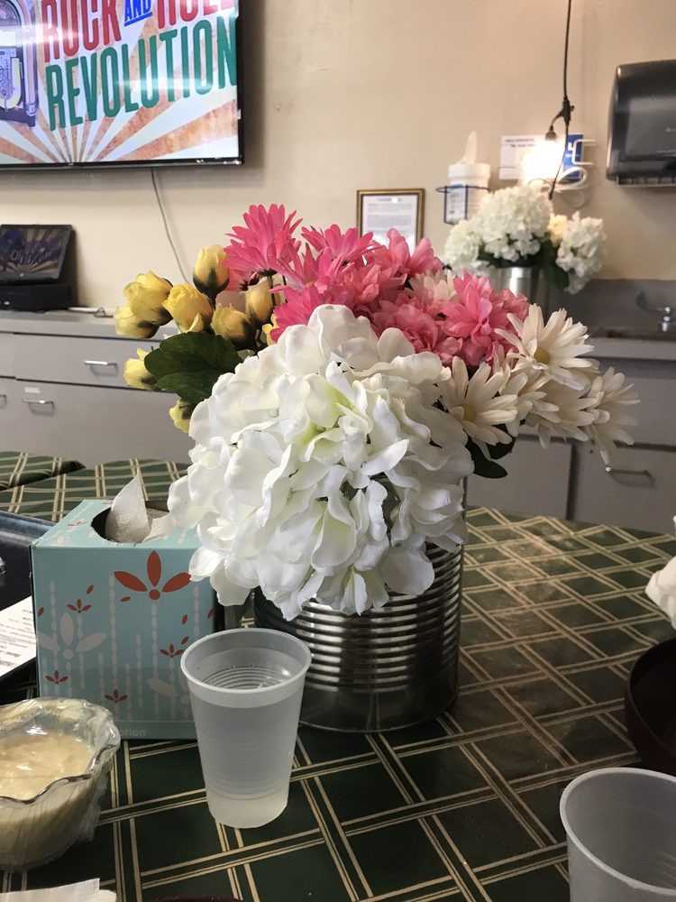 A colorful bouquet of flowers arranged in a vase on a table.