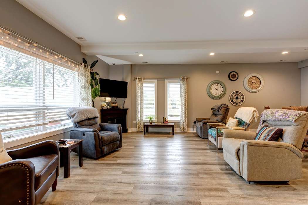 A modern and cozy living room with ample seating and natural light.