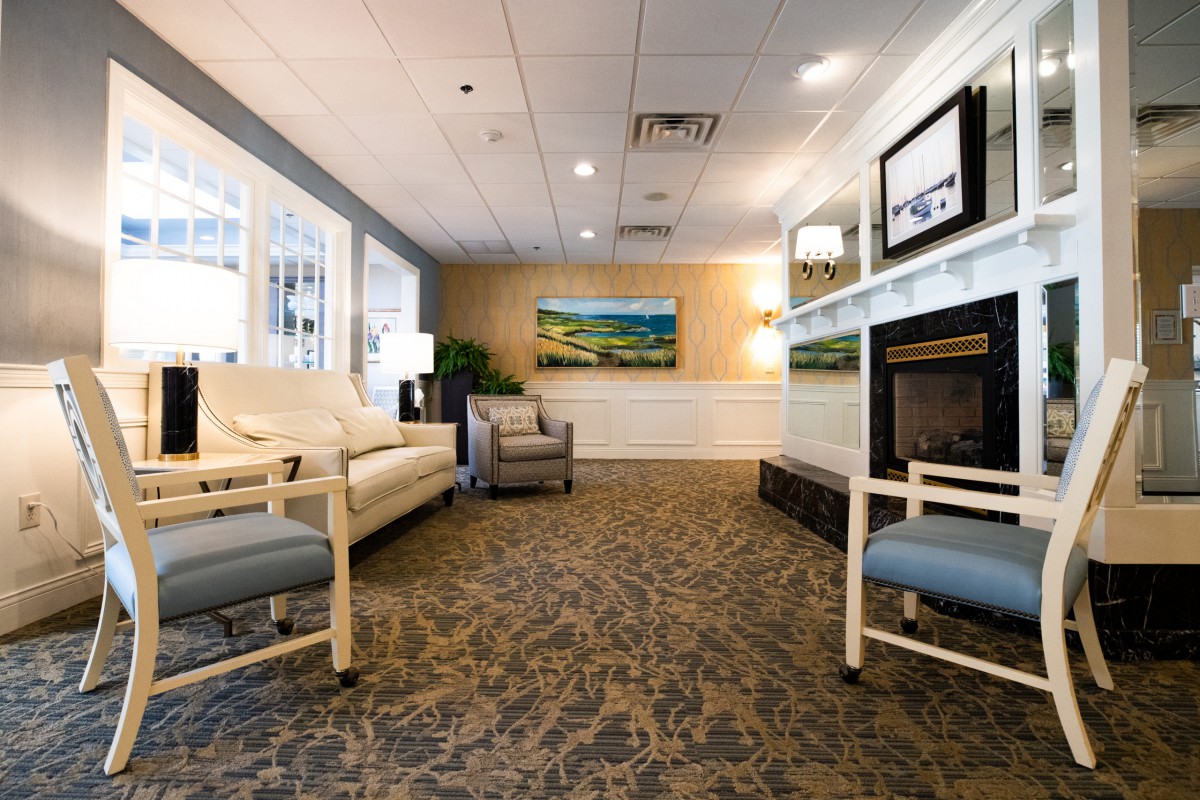 A modern lobby with comfortable seating, artwork, and a warm ambiance.
