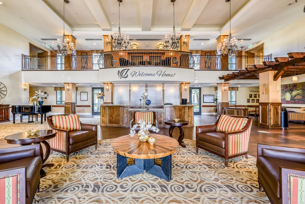 A luxurious hotel lobby with elegant furnishings and chandeliers.