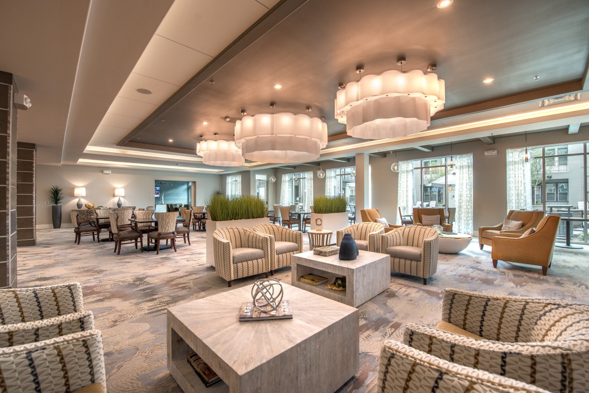 A stylish and cozy lounge area featuring modern furniture and elegant lighting.