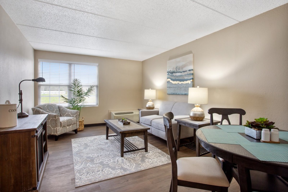 A cozy living room with comfortable seating and soft lighting.