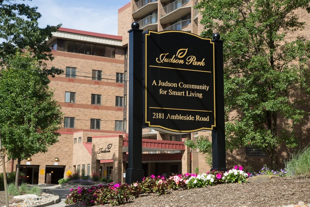 A retirement community building with a sign indicating smart living at Felicia Park.
