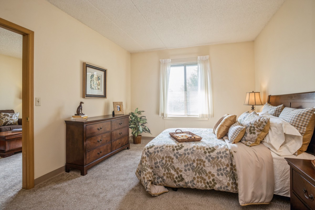 A cozy bedroom with elegant decor and natural light.