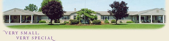 A residential house with a well-maintained garden and lawn.