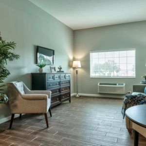 A well-lit living room with modern furniture and decor.
